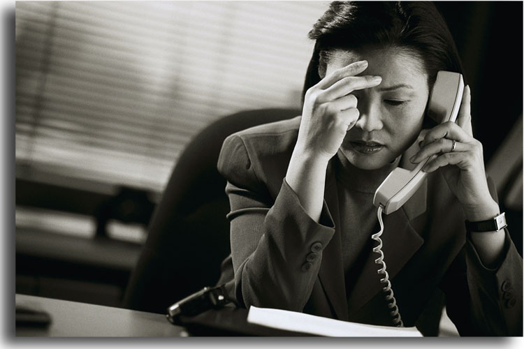 Frustrated Businesswoman on Telephone