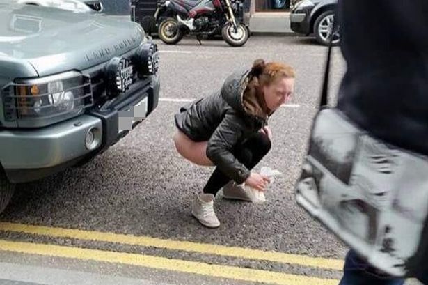 woman-appears-to-relieve-herself-on-busy-Aberdeen-street