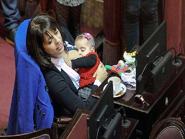 Pic shows: Victoria Donda Perez breastfeeding his baby. An MP gained popularity on social media after being filmed breastfeeding while on duty in Argentina.  Victoria Donda Perez ,47, was participating  in a normal session of the Argentinian Congress that she is a part of when her eight- month- old daughter Trilce got hungry. So the MP, who is also a lawyer, decided to breastfeed her  daughter while on duty in  Buenos Aires. It appears that Mrs Perez wanted to  set an example of both a loving mother and a hard working professional. Activist Mrs Perez  became a Congress member in 2007 when she was nicknamed " Dipusex "or sexy for her curvy looks. Supportive Juana commented on social media: "When your baby cries, all you want is calm her down. I admire her because many mother leave their children at the nursery although breast milk is so much better than any food" But user Zuzanne said "All right, but she should cover her breasts with one of those special bras. You dont have to wander around showing your boobs"  (ends)
