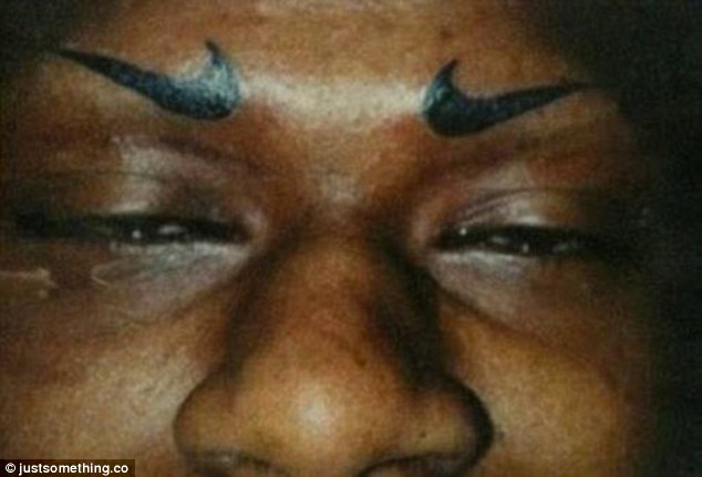 2A8B984700000578-3162111-A_sports_fan_had_Nike_swooshes_tattooed_where_his_eyebrows_ought-a-23_1436959799530
