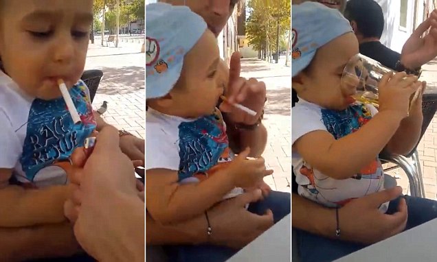 Pic shows: The boy drinking beer.nnA bad dad who made his child smoke and drink - and posted a video of it on the Internet - is being hunted by police in Spain.nnThe clip was posted on Facebook by a user called Daniel Tecu in Romania who asked people to identify the two adults in the video.nnFootage shows the Romanian man sitting with a little boy on his lap and laughing. Another man is filming and initially they both encourage the boy to smoke.nnThe man sitting on the chair puts the cigarette in the child's mouth.nnThe same person, who appears to be his father, makes the boy drink beer and then smoke again. One of them tells the boy "That's what being a real man is all about"nnDoina Dicu: "This man has to lose his parental rights. Child care officials should do something"nnAnother outraged viewe, Mihaela Stanciu, said: "There should be an exam for everyone who wants to have a child. If you fail, you can't have them. Otherwise we'll fill this planet with retarded, degenerate people."nnThe people involved have not yet been identified, but it is believed the incident took place in Spain where there is a large Romanian immigrant population mainly working in farm labour and other low-paid jobs.nn(ends)nn