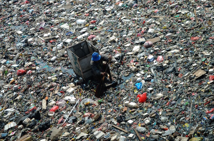 Mandatory Credit: Photo by Nurcholis/REX (1381470e) A garbage scavenger trawling for useful items Ocean of refuse, River Sentiong, Sunter Agung, Tanjung Priok, Jakarta, Indonesia - 14 Jul 2011 Rubbish thrown into the river is becoming a growing problem in Jakarta, Indonesia. In some areas the River Sentiong is virtually impassable due to stinking piles of refuse. When the river floods this causes the water to break its banks, flooding nearby homes with filthy water and garbage. Each day a myriad array of junk, including plastics, sofas, mattresses, Styrofoam, shoes etc., piles up along a 1km stretch of water. It is carefully picked over for anything useful by garbage scavengers as well as being carried away by river 'janitors'. Their task is a never ending one with each new day bringing ever more rubbish. It flows down from further upstream, having been discarded by residents along the river bank, but is stopped from passing into the sea by a special garbage net. However, this doesn't stop contaminants from the refuse leaking through and polluting the sea.