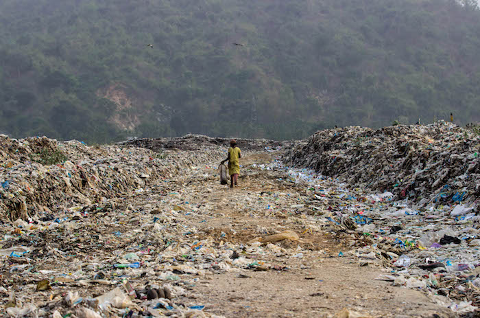 Mandatory Credit: Photo by Partha Hazarika/NurPhoto/REX (4686943j) A Indian girl look for recyclable materials at the garbage dump Locals scavenging rubbish tip for recyclable materials ahead of World Earth Day, Guwahati, Assam, India - 21 Apr 2015