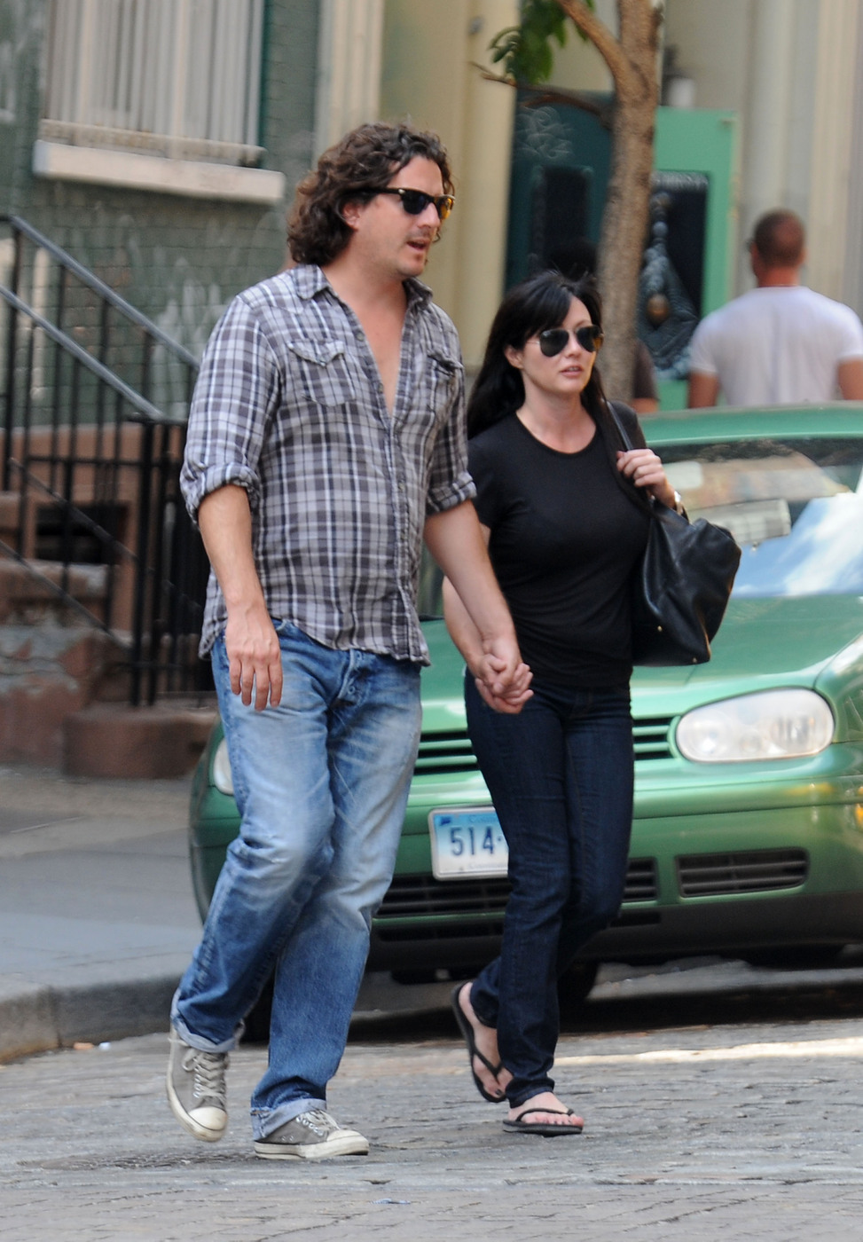 43147, NEW YORK, NEW YORK - Saturday July 31, 2010. Is Shannen Doherty pregnant? The actress is seen looking a bit heavier set while holding hands with photographer boyfriend Kurt Iswarienko in NYC. **FRANCE, AUSTRALIA, NEW ZEALAND AND EASTERN EUROPE OUT** Photograph: © Hector Vallenilla, PacificCoastNews.com**FEE MUST BE AGREED PRIOR TO USAGE** **E-TABLET/IPAD & MOBILE PHONE APP PUBLISHING REQUIRES ADDITIONAL FEES** UK OFFICE:+44 131 557 7760/7761 US OFFICE:1 310 261 9676