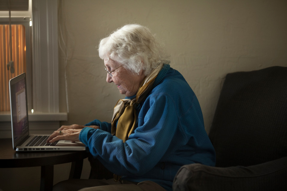 Senior woman working on a laptop computer.