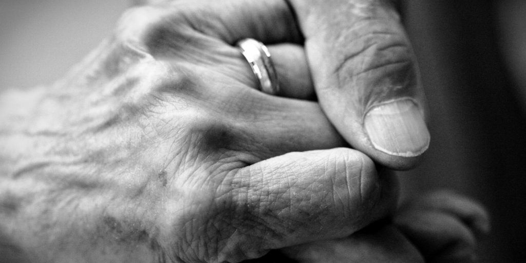 Caring Hand on Senior Hand