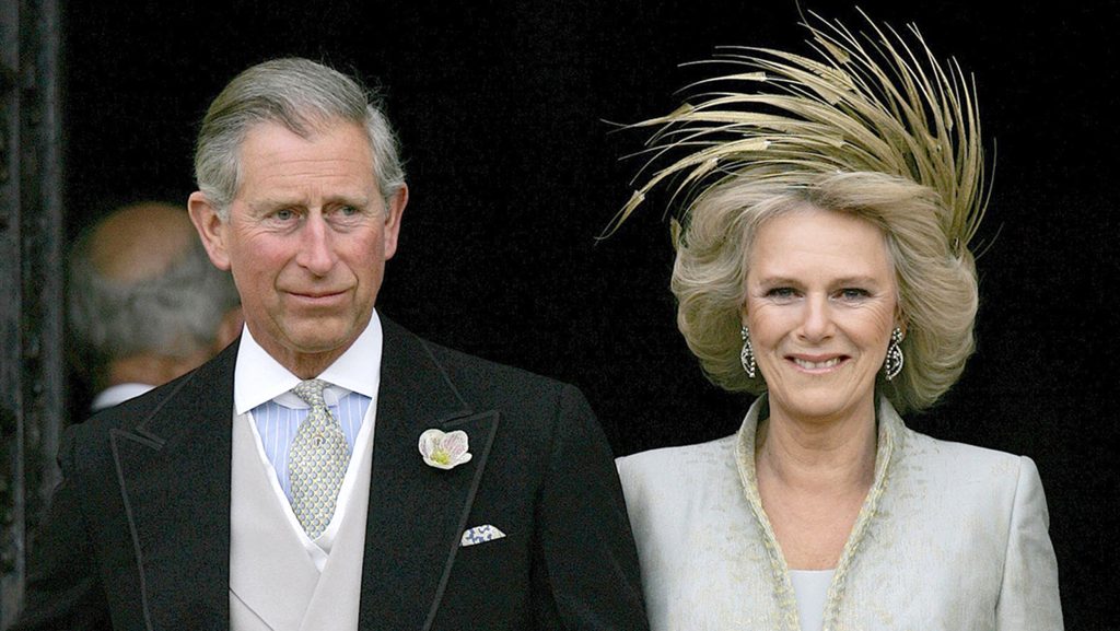 Britain's Prince Charles and his bride Camilla, Duchess of Cornwall leave St George's Chapel in Windsor following the church blessing of their civil wedding ceremony, 09 April 2005. Prince Charles married Camilla Parker Bowles, the true love of his life, on Saturday in a private civil ceremony that inevitably paled against his storybook wedding to Princess Diana more than 20 years ago. (Photo credit should read Alastair Grant/AFP/Getty Images)